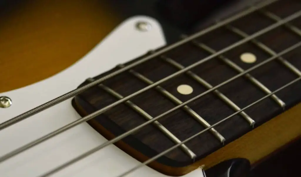 4-string bass guitar laying on its back