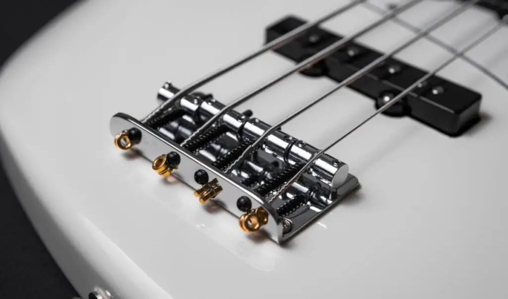 bass guitar with low actions bridge with metal saddles