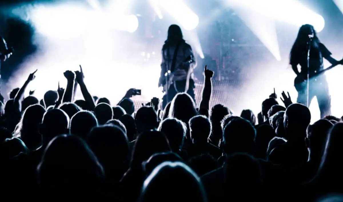 metal bass player and guitarist on stage