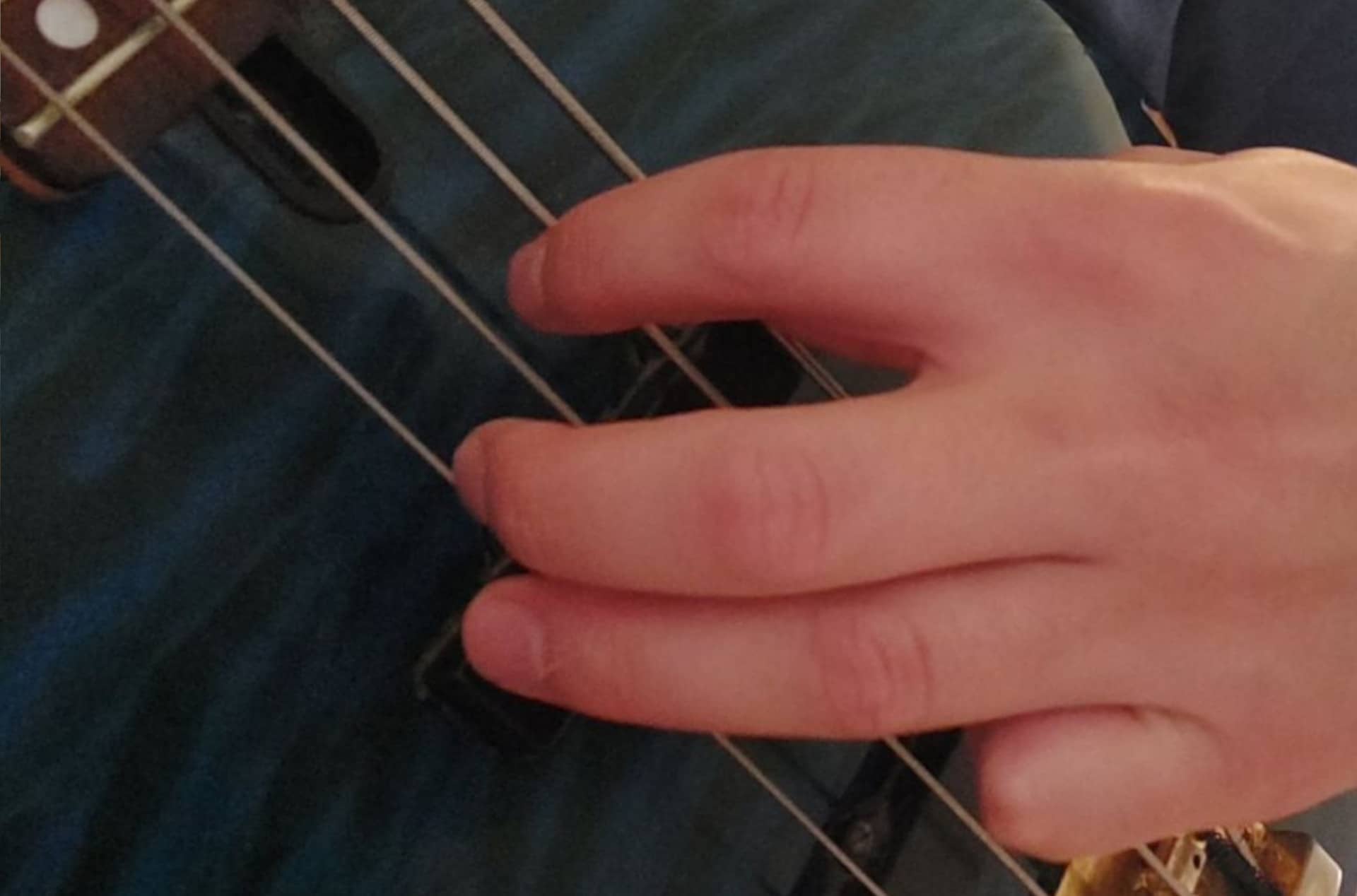 bass being strummed with fingers