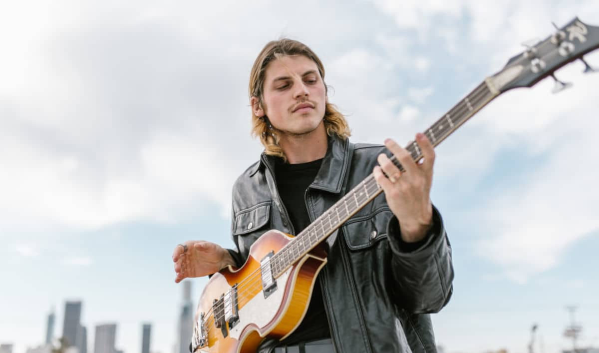 bassist playing short-scale hofner bass