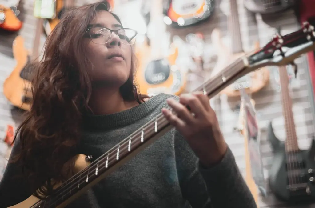 bassist concentrating on playing a bass solo