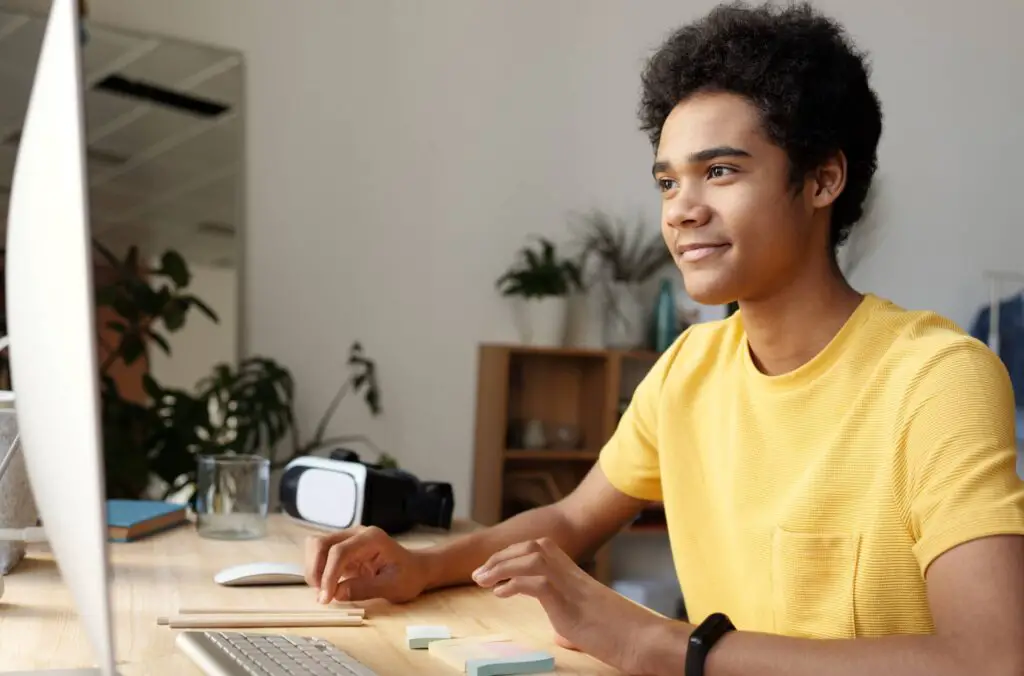 young student watching online lesson