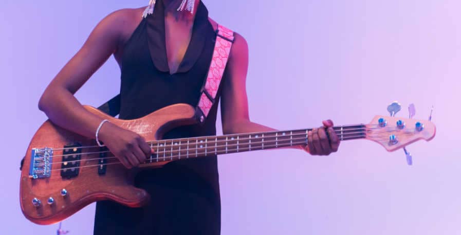 4-string bass being played with one finger