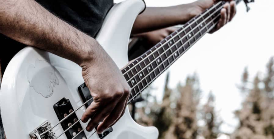 bassist playing 4-string bass guitar with 3 fingers