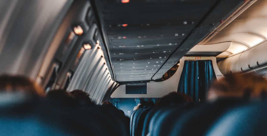 passengers sitting in aircraft cabin