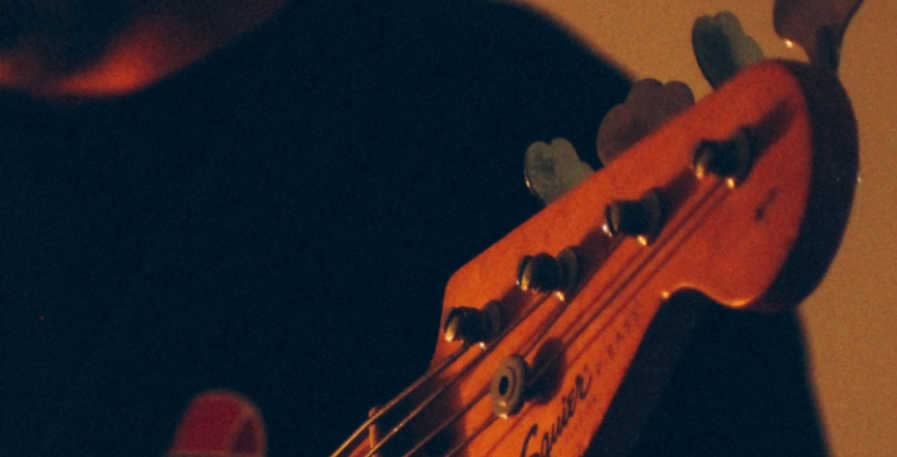 tuning pegs on 4-string bass guitar