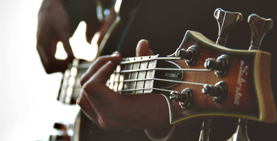 newly restringed 4-string bass guitar being played