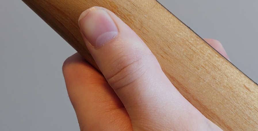 how to position fretting hand thumb when playing bass guitar
