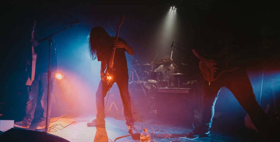 metal band playing live on stage