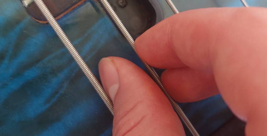4-string bass being played with floating thumb technique