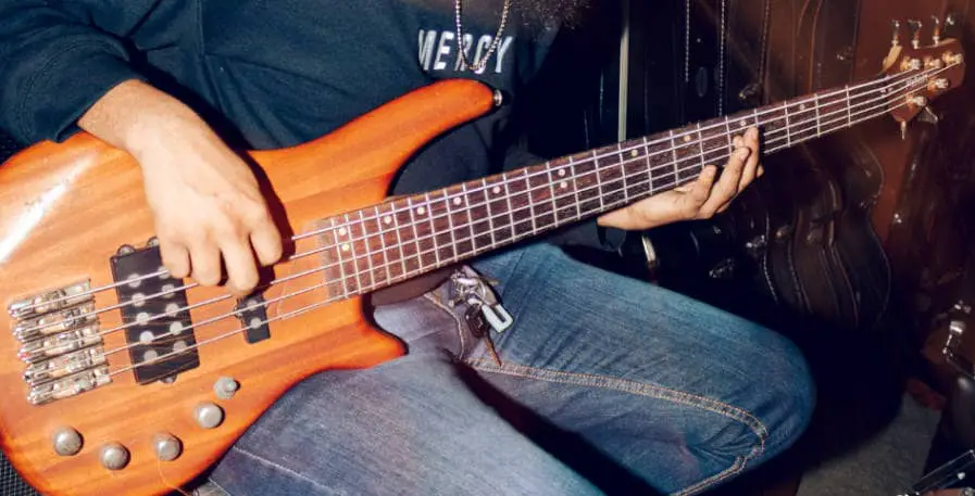 5 string bass guitar being in lap