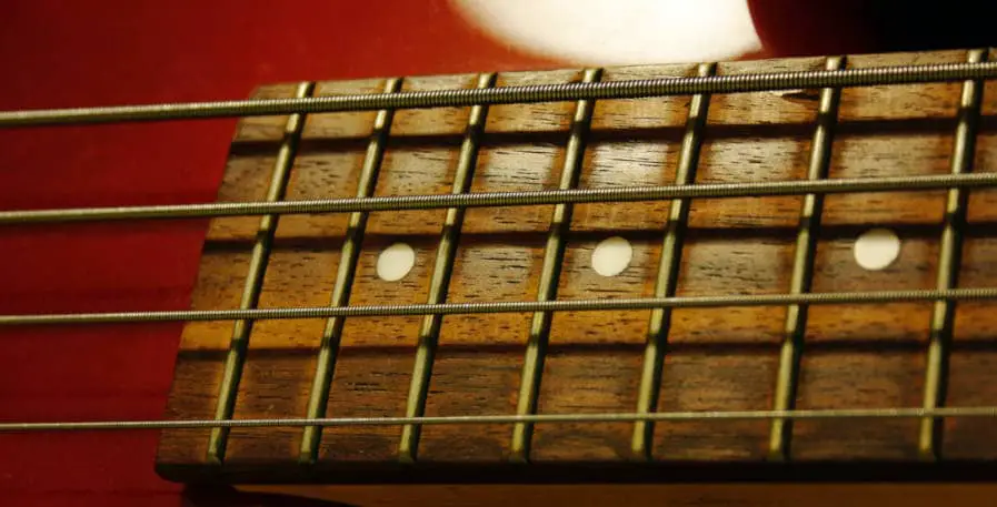 bass strings strung onto 4-string bass guitar