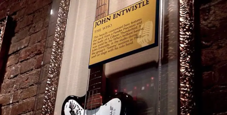 john entwistles bass guitar hanging on wall