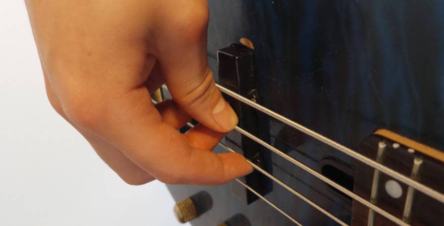 bass guitar plucked with fingers