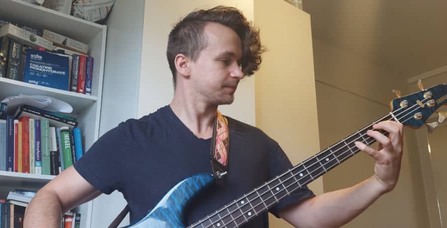 Ian Partanen practicing the bass guitar