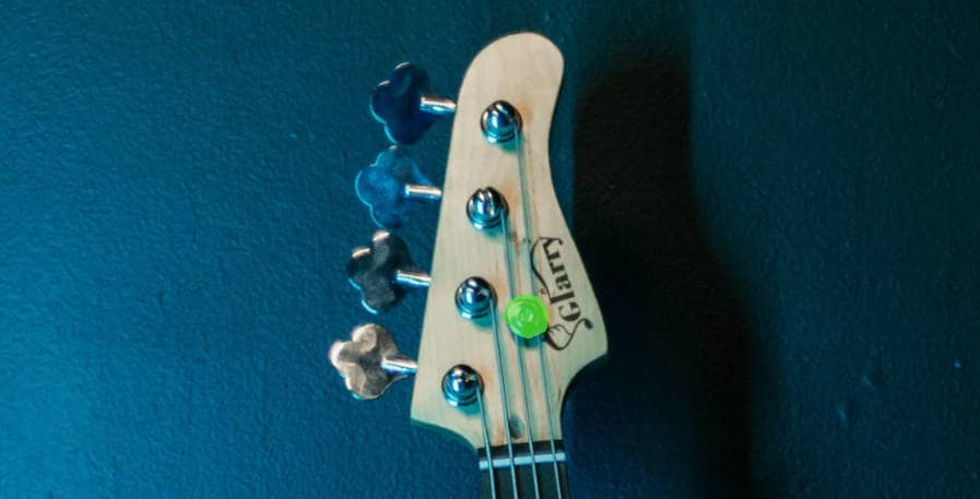 String post on bass guitar headstock highlighted
