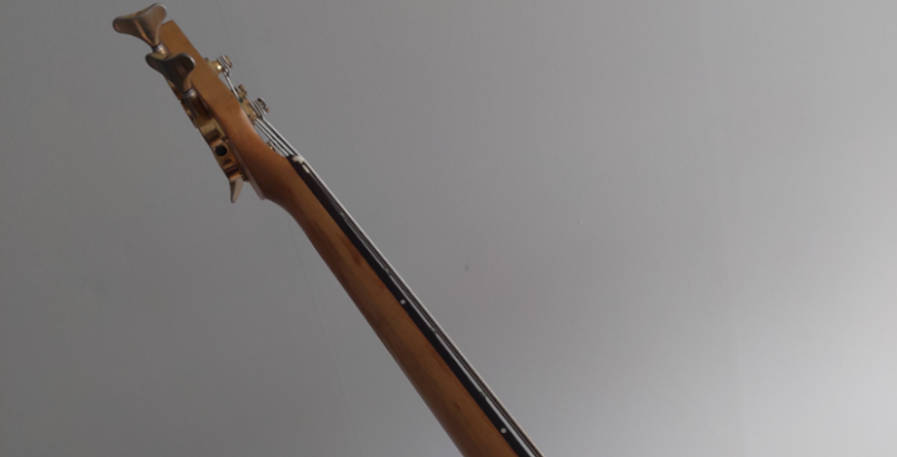 point of view of a bass player holding a bass guitar