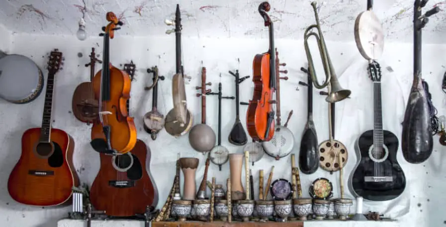 various musical instruments hanging on wall