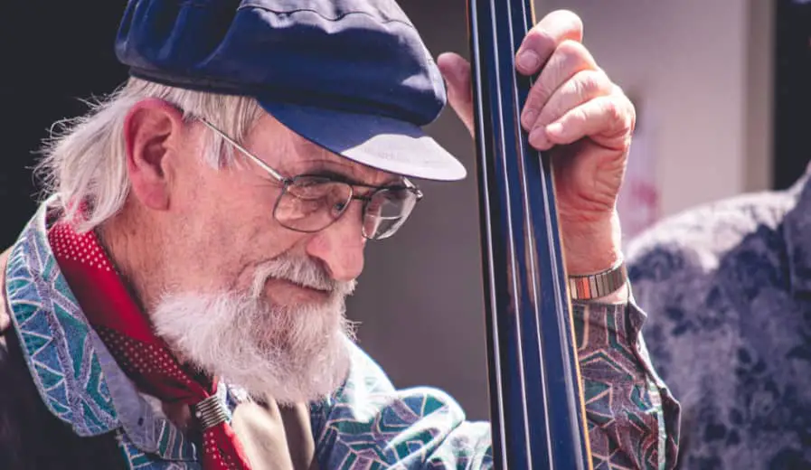 bassist playing a walking bass line on a double bass