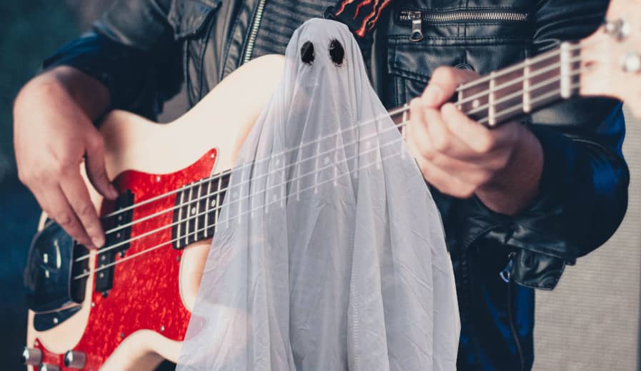 bassist playing ghost note with a ghost layered on top of him