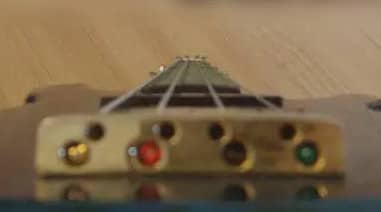 looking up neck of a bass guitar