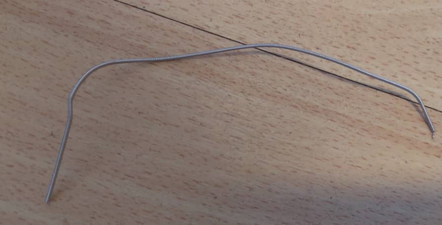 what a piece of a broken bass string looks like