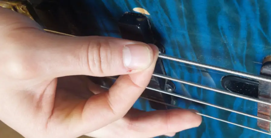 Example of how chucking can be used to pluck a bass guitar